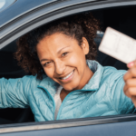 Licenses for immigrants without documents - hispanic woman holding driver's license