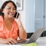 Hispanic woman on phone - Free internet and phone plans